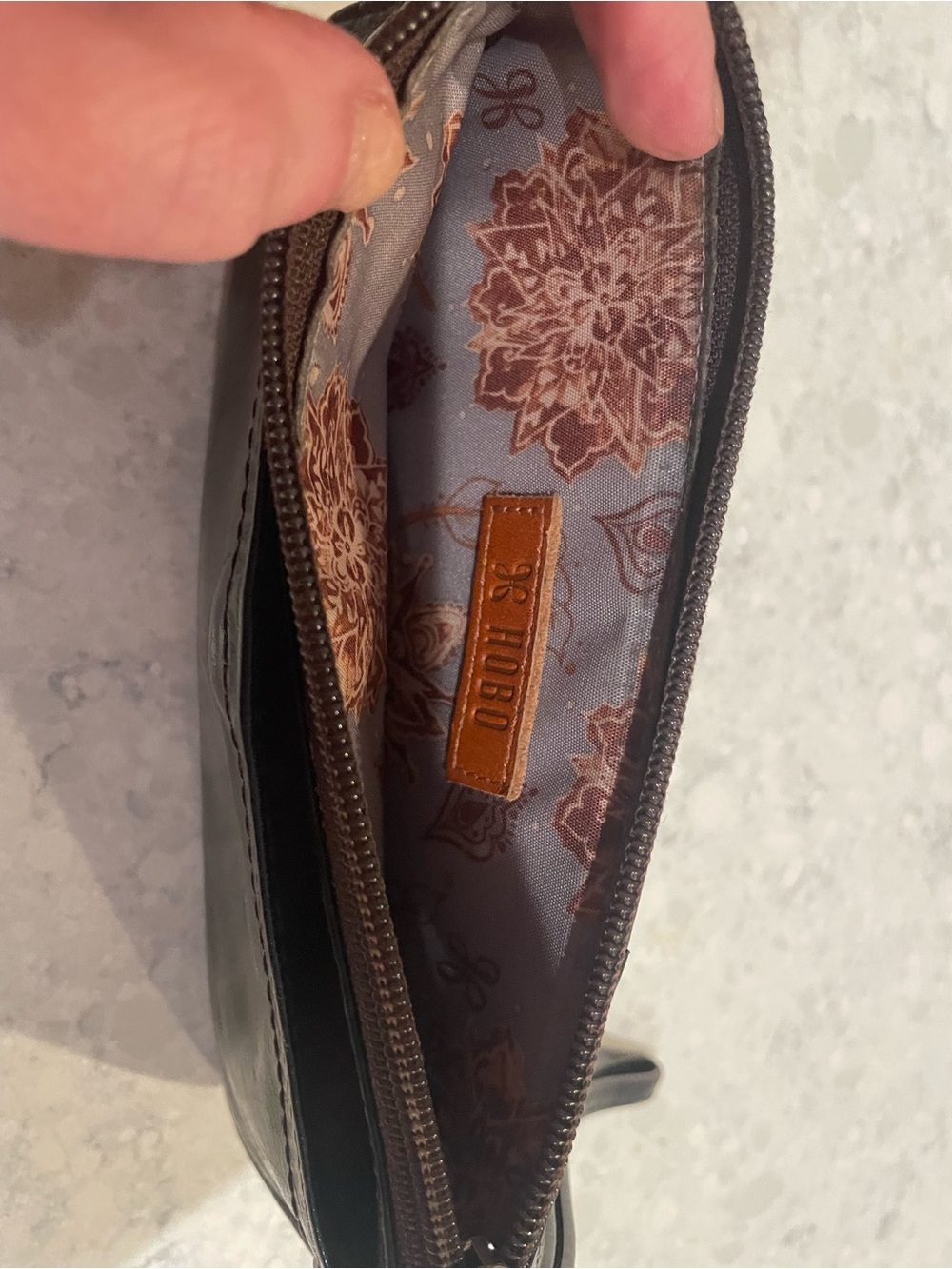 HOBO Black Leather Wristlet with Brown Interior Patch and Floral Lining
